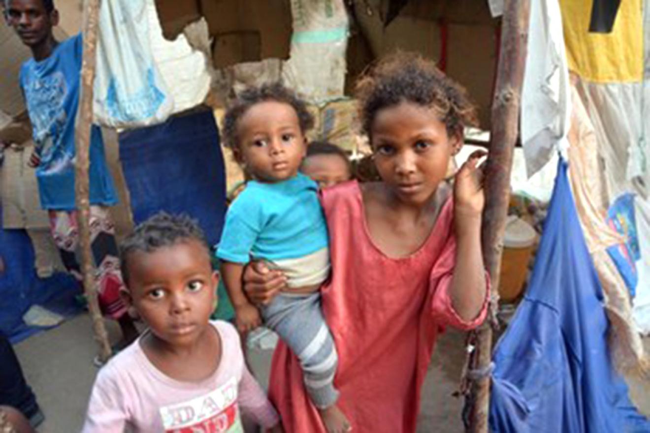 A group of children looking at the camera.